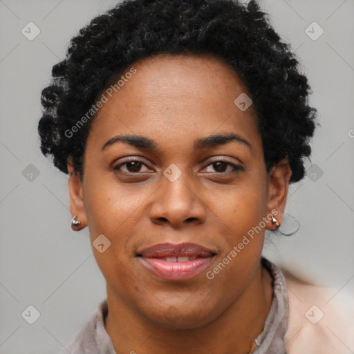 Joyful black young-adult female with short  black hair and brown eyes