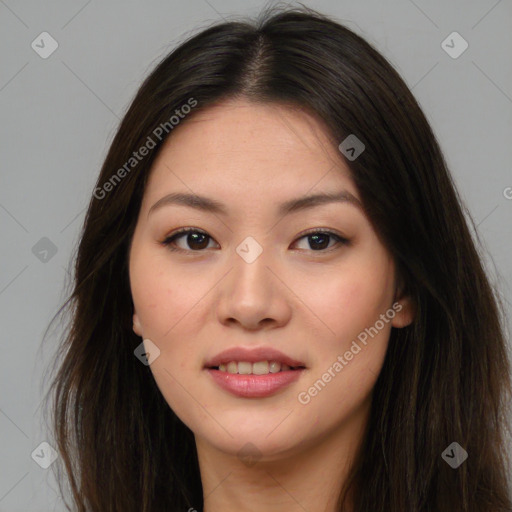 Joyful asian young-adult female with long  brown hair and brown eyes