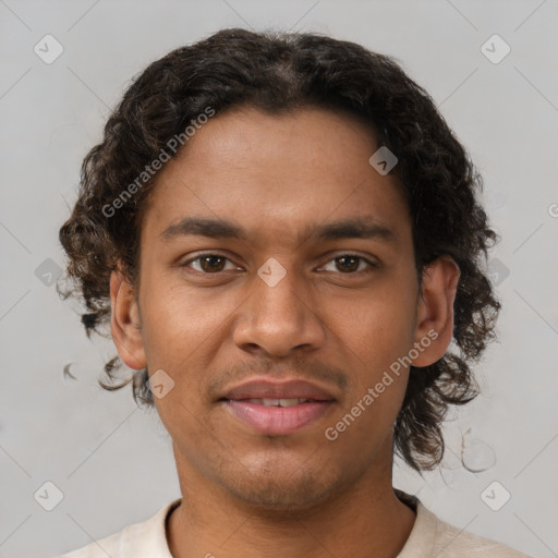 Joyful latino young-adult male with short  brown hair and brown eyes