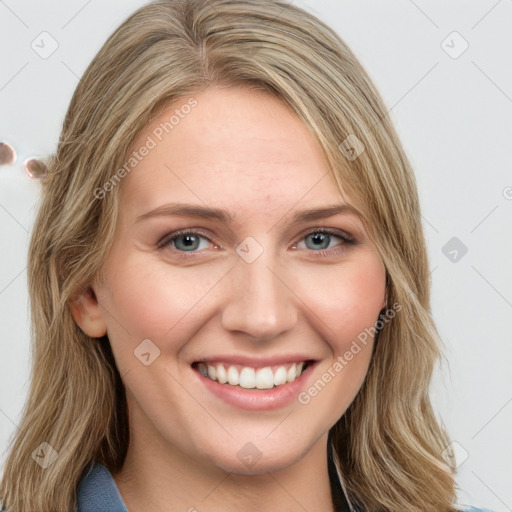 Joyful white young-adult female with long  brown hair and blue eyes