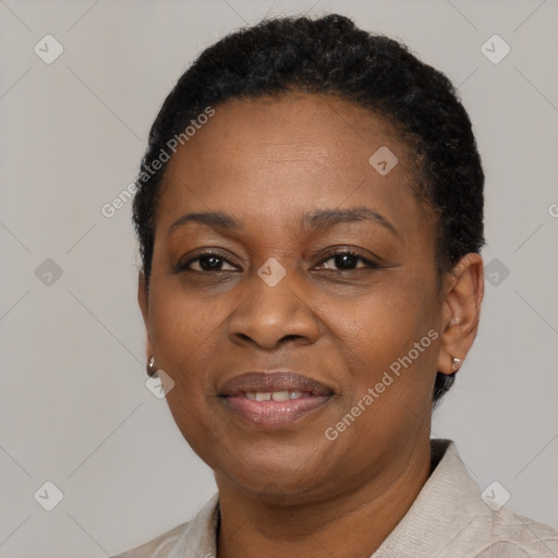 Joyful black adult female with short  black hair and brown eyes