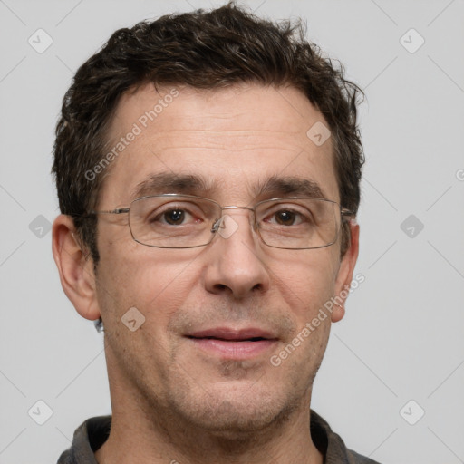 Joyful white adult male with short  brown hair and grey eyes