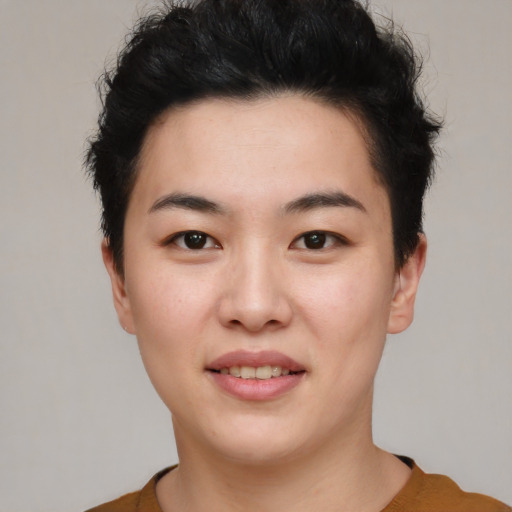 Joyful asian young-adult female with short  black hair and brown eyes