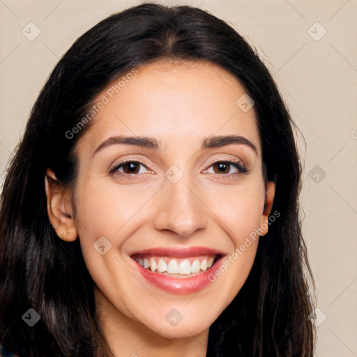 Joyful white young-adult female with long  black hair and brown eyes