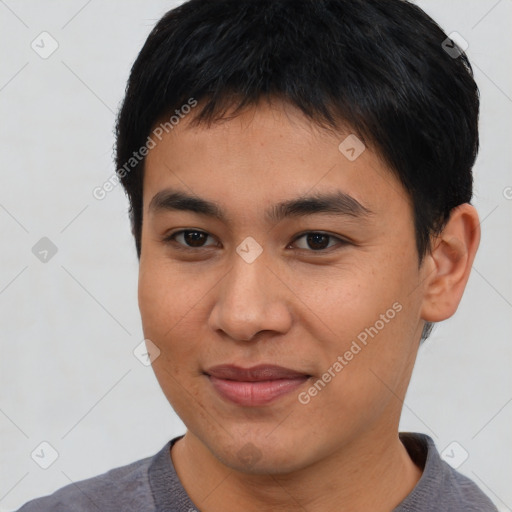 Joyful asian young-adult male with short  brown hair and brown eyes