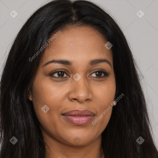 Joyful black young-adult female with long  brown hair and brown eyes