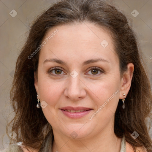 Joyful white adult female with long  brown hair and grey eyes