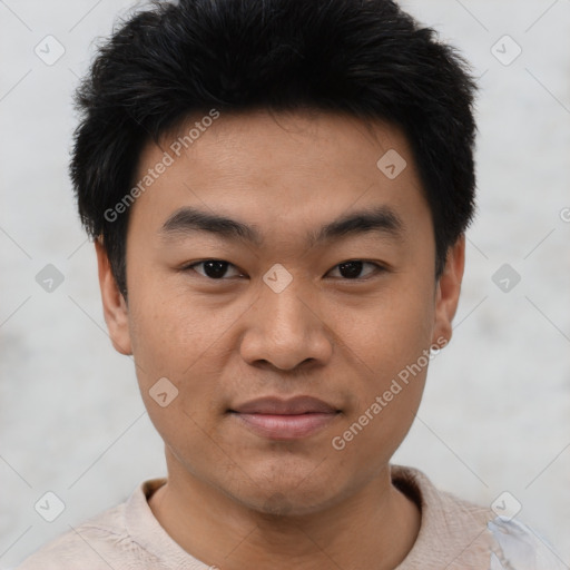 Joyful asian young-adult male with short  black hair and brown eyes