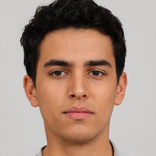Neutral latino young-adult male with short  brown hair and brown eyes