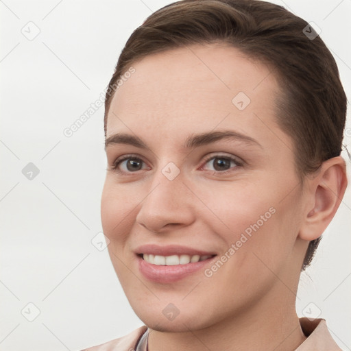 Joyful white young-adult female with short  brown hair and brown eyes