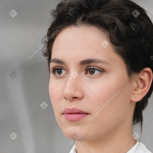 Neutral white young-adult female with medium  brown hair and brown eyes