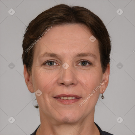 Joyful white adult female with short  brown hair and grey eyes