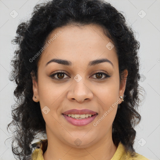 Joyful black young-adult female with long  brown hair and brown eyes