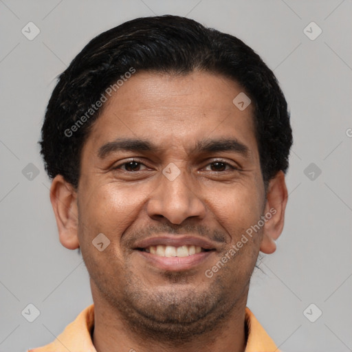 Joyful latino young-adult male with short  brown hair and brown eyes