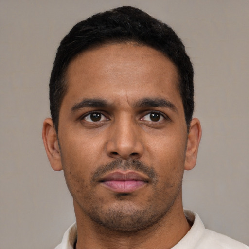 Neutral latino young-adult male with short  black hair and brown eyes