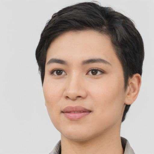 Joyful asian young-adult female with short  black hair and brown eyes