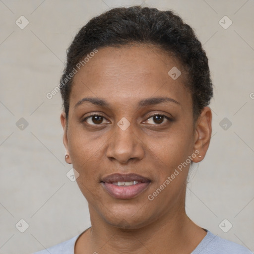 Joyful black young-adult female with short  brown hair and brown eyes