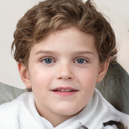 Joyful white child male with short  brown hair and blue eyes