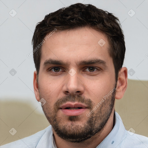 Neutral white young-adult male with short  brown hair and brown eyes