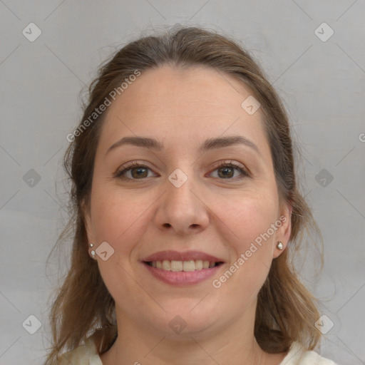 Joyful white young-adult female with medium  brown hair and grey eyes