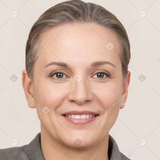 Joyful white adult female with short  brown hair and brown eyes