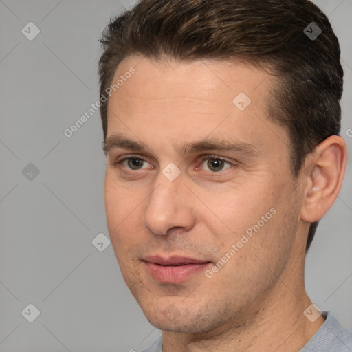 Joyful white adult male with short  brown hair and brown eyes