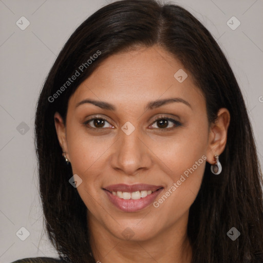 Joyful black young-adult female with long  brown hair and brown eyes