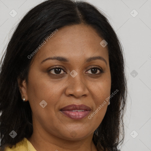 Joyful black adult female with long  brown hair and brown eyes