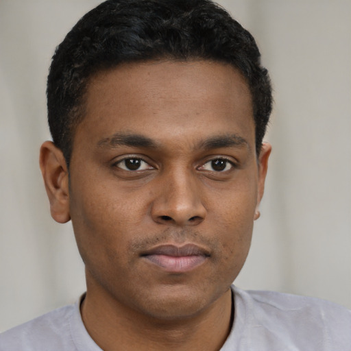 Neutral black young-adult male with short  brown hair and brown eyes