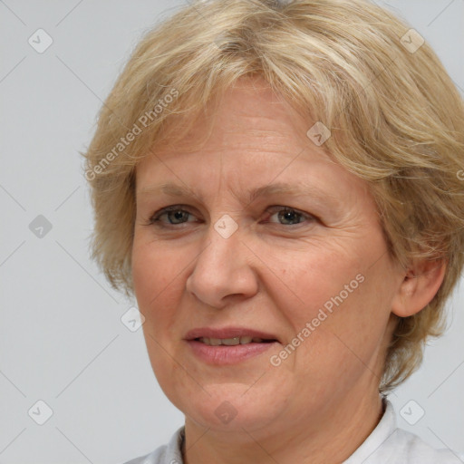 Joyful white middle-aged female with medium  brown hair and brown eyes