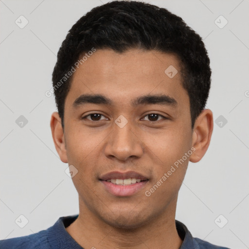 Joyful latino young-adult male with short  black hair and brown eyes