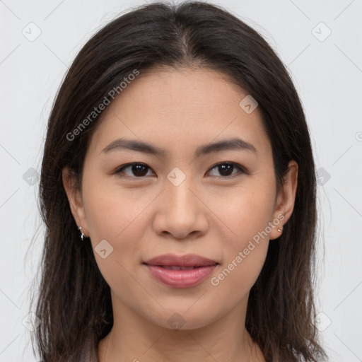 Joyful asian young-adult female with long  brown hair and brown eyes