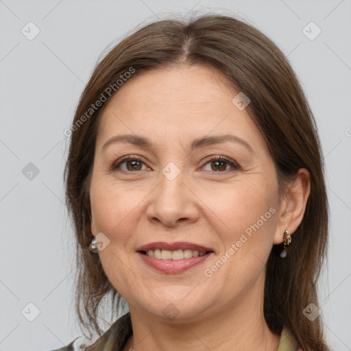 Joyful white adult female with medium  brown hair and grey eyes