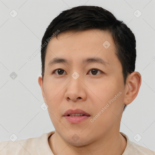 Neutral white young-adult male with short  black hair and brown eyes