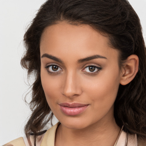 Joyful white young-adult female with long  brown hair and brown eyes