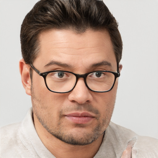 Joyful white adult male with short  brown hair and brown eyes