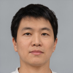 Neutral asian young-adult male with short  brown hair and brown eyes