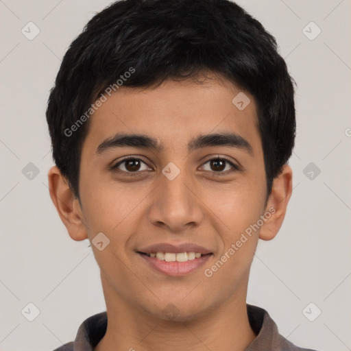 Joyful latino young-adult male with short  black hair and brown eyes