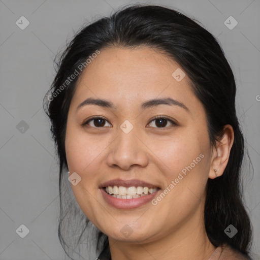 Joyful asian young-adult female with medium  black hair and brown eyes