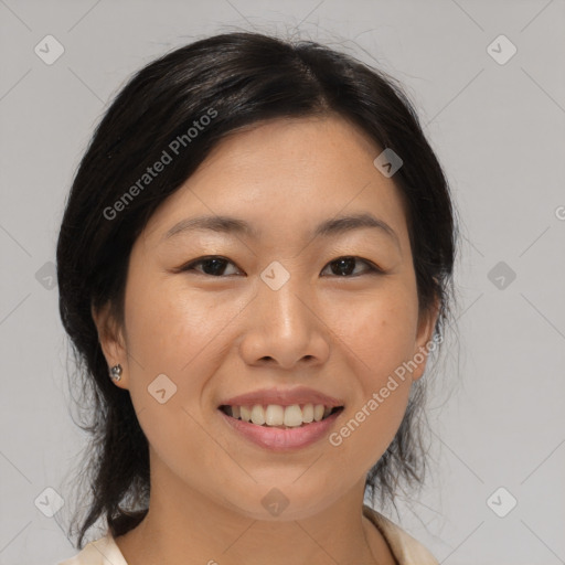 Joyful asian young-adult female with medium  black hair and brown eyes