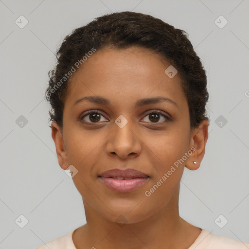 Joyful black young-adult female with short  brown hair and brown eyes