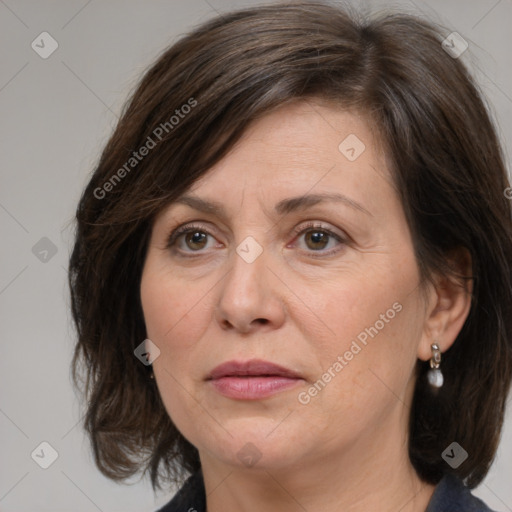 Joyful white adult female with medium  brown hair and brown eyes