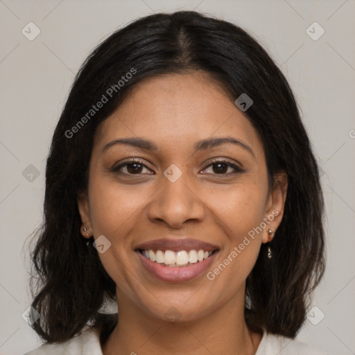 Joyful black young-adult female with medium  brown hair and brown eyes