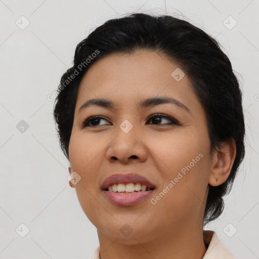 Joyful asian young-adult female with medium  black hair and brown eyes