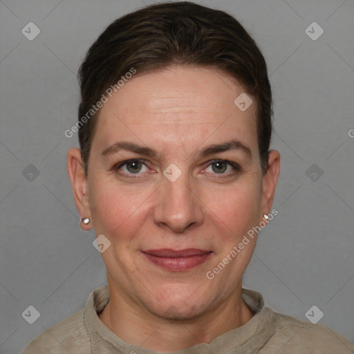 Joyful white adult female with short  brown hair and grey eyes