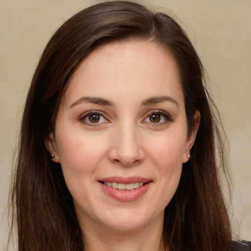 Joyful white young-adult female with long  brown hair and brown eyes