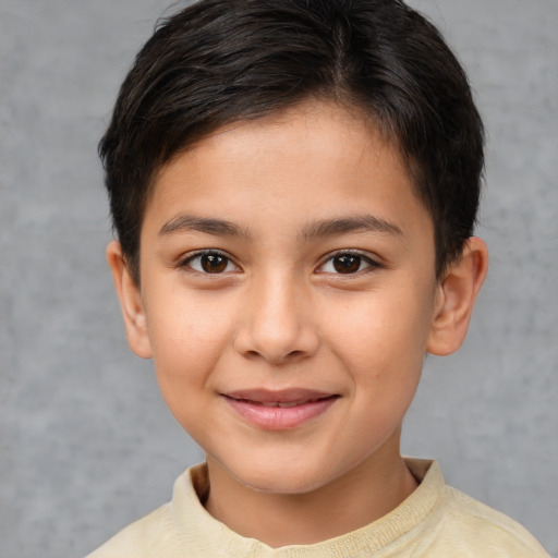 Joyful white child female with short  brown hair and brown eyes