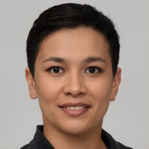 Joyful latino young-adult female with short  black hair and brown eyes