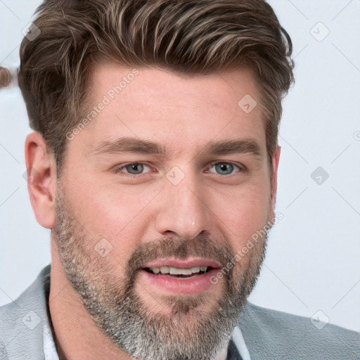 Joyful white young-adult male with short  brown hair and blue eyes