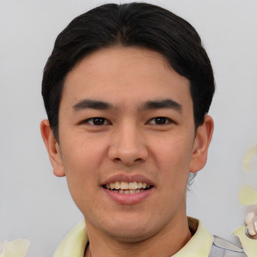 Joyful asian young-adult male with short  black hair and brown eyes